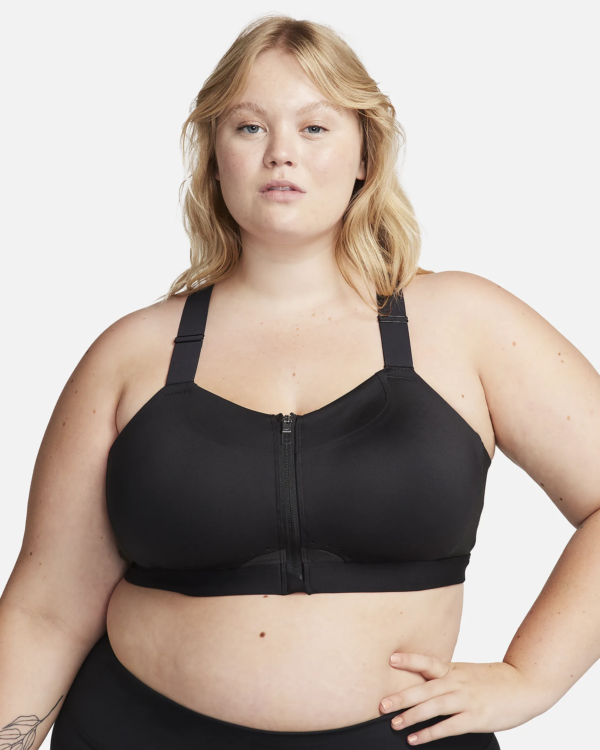A woman wearing a dark sports bra.